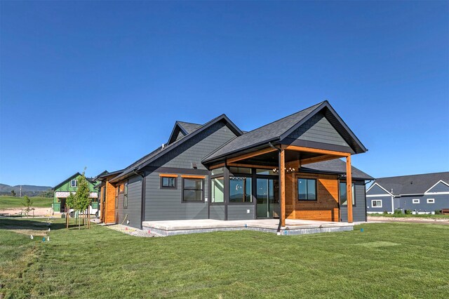 2736 Paniolo Pl, Missoula, MT 59808 - back of house with a yard and a patio