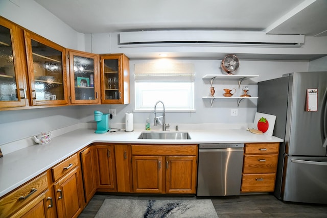 1536 Meadowlark Dr Unit 10B, Great Falls, MT 59404 - kitchen with appliances with stainless steel finishes, brown cabinetry, light countertops, and glass insert cabinets