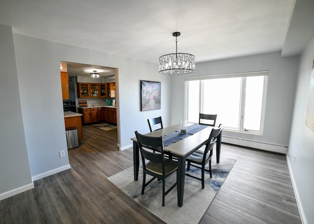 1536 Meadowlark Dr Unit 10B, Great Falls, MT 59404 - dining space with a baseboard radiator, a chandelier, and dark wood finished floors