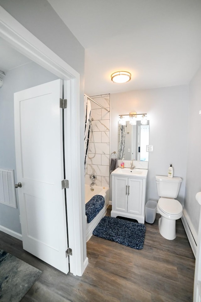 1536 Meadowlark Dr Unit 10B, Great Falls, MT 59404 - bathroom with vanity, baseboard heating, wood finished floors, and tub / shower combination