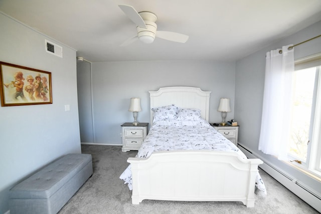 1536 Meadowlark Dr Unit 10B, Great Falls, MT 59404 - bedroom featuring light colored carpet, a baseboard radiator, and ceiling fan