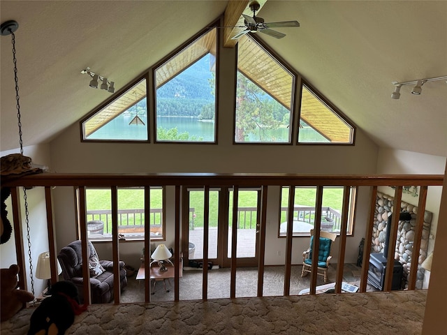 living room with rail lighting, carpet, high vaulted ceiling, and a ceiling fan
