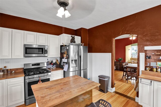 500 34th St NW, Great Falls, MT 59404 - kitchen featuring stainless steel appliances, ceiling fan, butcher block counters, and light wood-style floors