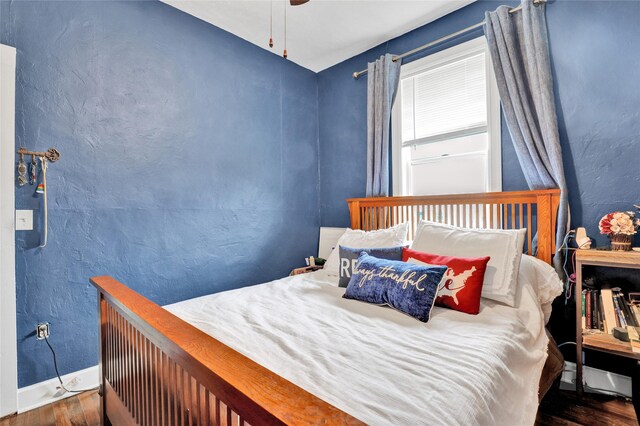500 34th St NW, Great Falls, MT 59404 - bedroom with wood finished floors, baseboards, and a ceiling fan