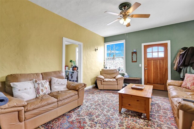 500 34th St NW, Great Falls, MT 59404 - living area with ceiling fan, carpet flooring, baseboards, and a textured wall