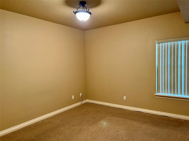 2905 Oshaughnesy St Unit 104, Missoula, MT 59808 - spare room featuring carpet flooring and baseboards
