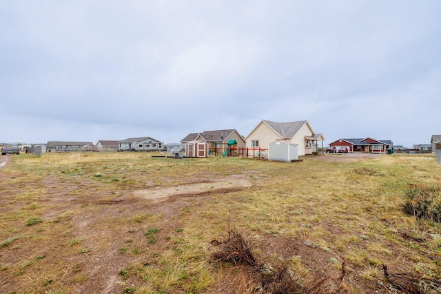 view of yard with a shed and an outbuilding
