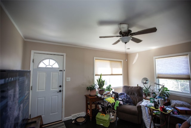1011 4th Ave NW, Great Falls, MT 59404 - foyer with ceiling fan, plenty of natural light, ornamental molding, and baseboards