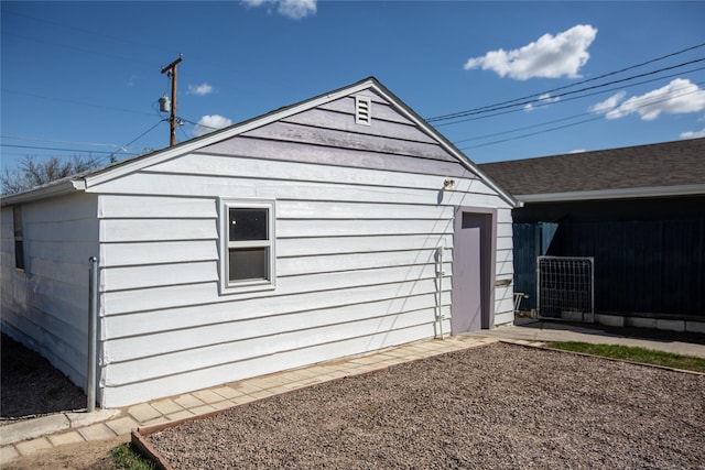 1011 4th Ave NW, Great Falls, MT 59404 - view of home's exterior with fence, an outdoor structure, and central AC