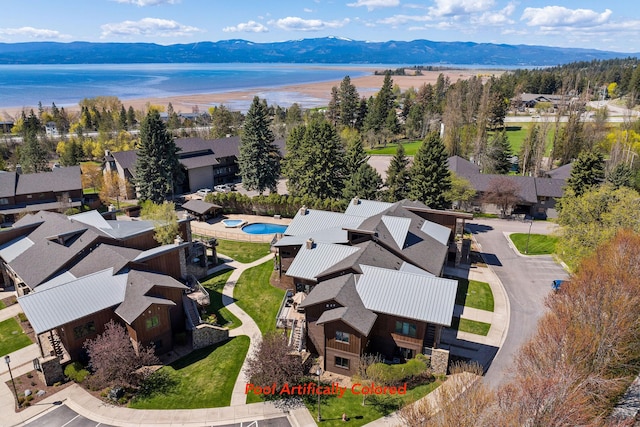aerial view of residential area with a water and mountain view