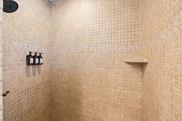 full bathroom with tiled shower