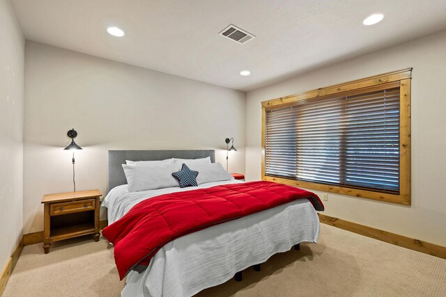 carpeted bedroom with baseboards and recessed lighting