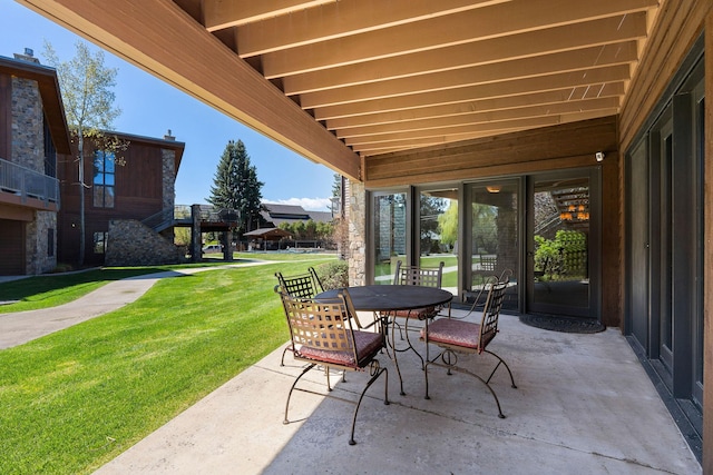 view of patio featuring outdoor dining area