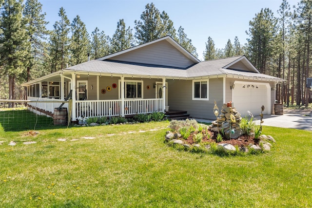 806 Timberbrook Ln, Hamilton, MT 59840 - view of front of house with covered porch, an attached garage, driveway, and a front lawn