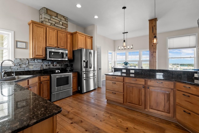 58 Morning View Way, Kalispell, MT 59901 - kitchen featuring stainless steel appliances, a sink, hardwood / wood-style flooring, plenty of natural light, and recessed lighting