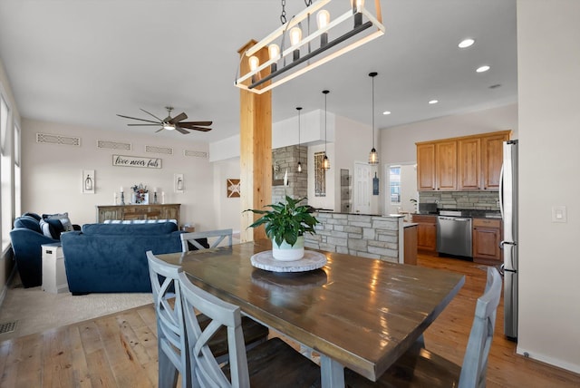 58 Morning View Way, Kalispell, MT 59901 - dining area with light wood-style floors, ceiling fan, and recessed lighting