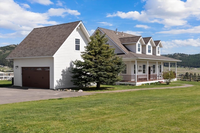 58 Morning View Way, Kalispell, MT 59901 - view of front of home featuring a porch, a front lawn, a shingled roof, and asphalt driveway