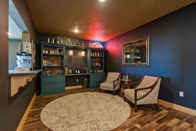 58 Morning View Way, Kalispell, MT 59901 - living area with baseboards, dark wood-type flooring, a bar, and recessed lighting