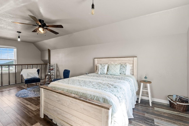 58 Morning View Way, Kalispell, MT 59901 - bedroom featuring wood finished floors, vaulted ceiling, baseboards, and ceiling fan