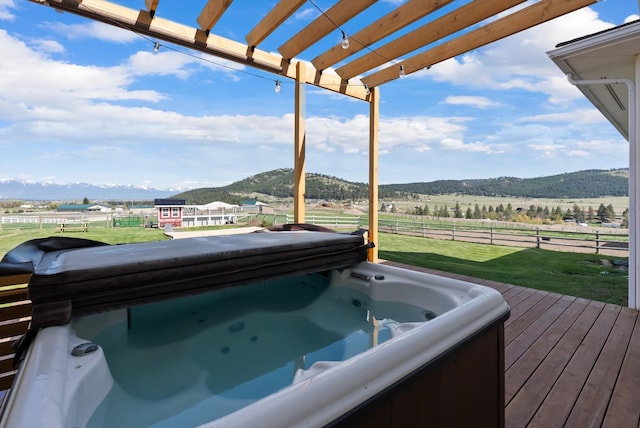 58 Morning View Way, Kalispell, MT 59901 - wooden terrace with a hot tub, a mountain view, a rural view, and a pergola