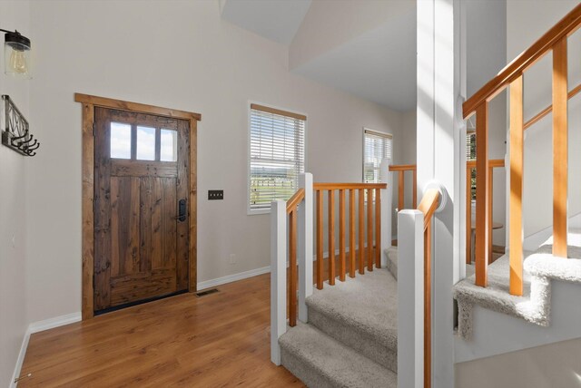 58 Morning View Way, Kalispell, MT 59901 - entryway with plenty of natural light, wood finished floors, stairway, and baseboards