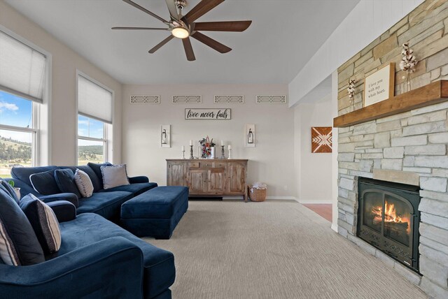 58 Morning View Way, Kalispell, MT 59901 - carpeted living area with a ceiling fan, a fireplace, and baseboards