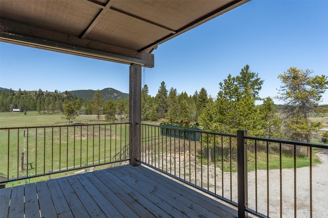 5550 Farm To Market Rd, Whitefish, MT 59937 - wooden terrace with a mountain view and a yard