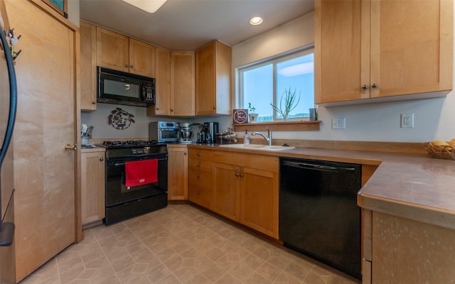 5550 Farm To Market Rd, Whitefish, MT 59937 - kitchen with black appliances, a sink, recessed lighting, light countertops, and light brown cabinets