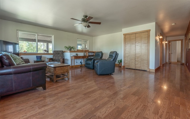 5550 Farm To Market Rd, Whitefish, MT 59937 - living room featuring a ceiling fan, wood finished floors, and baseboards