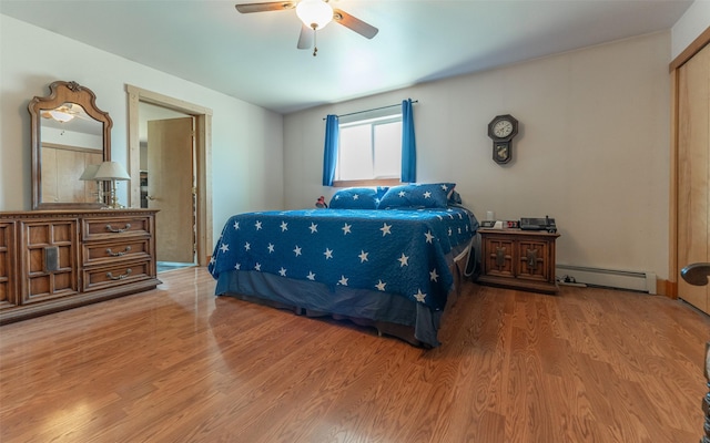5550 Farm To Market Rd, Whitefish, MT 59937 - bedroom featuring a baseboard radiator, wood finished floors, and a ceiling fan