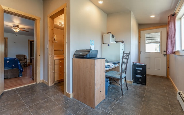 5550 Farm To Market Rd, Whitefish, MT 59937 - office featuring dark tile patterned floors, a baseboard heating unit, baseboards, a ceiling fan, and recessed lighting
