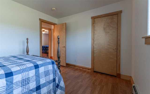 5550 Farm To Market Rd, Whitefish, MT 59937 - bedroom with a baseboard radiator, wood finished floors, and baseboards