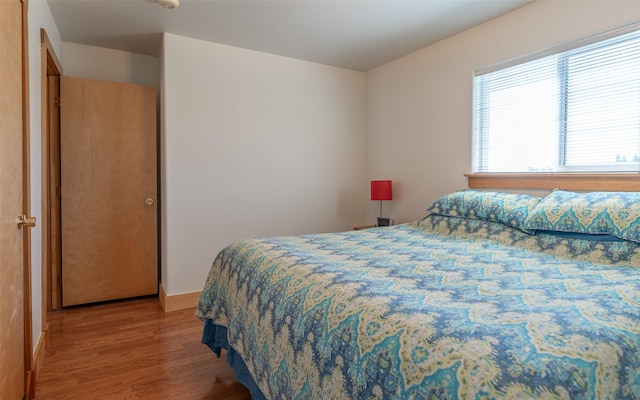 5550 Farm To Market Rd, Whitefish, MT 59937 - bedroom featuring light wood-style flooring and baseboards