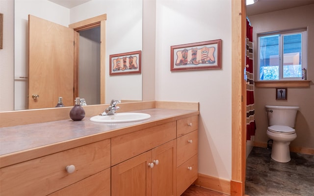 5550 Farm To Market Rd, Whitefish, MT 59937 - bathroom featuring vanity, baseboards, and toilet