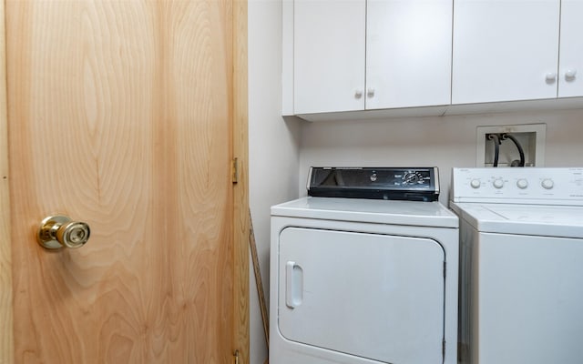 5550 Farm To Market Rd, Whitefish, MT 59937 - washroom featuring washing machine and dryer and cabinet space