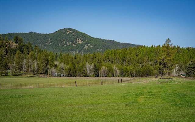 5550 Farm To Market Rd, Whitefish, MT 59937 - view of mountain background featuring a heavily wooded area and rural landscape