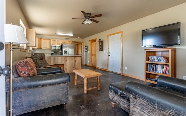 5550 Farm To Market Rd, Whitefish, MT 59937 - living area featuring finished concrete flooring, ceiling fan, and baseboards