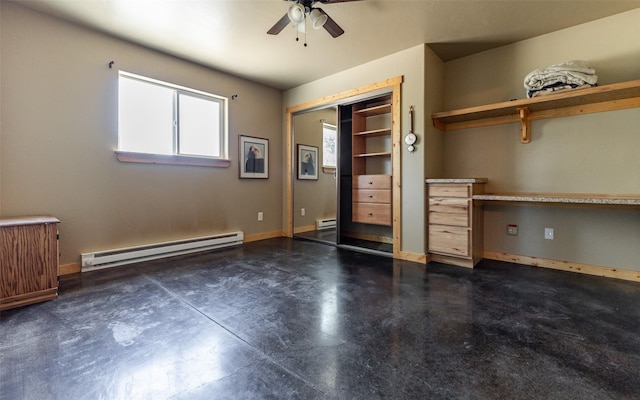5550 Farm To Market Rd, Whitefish, MT 59937 - unfurnished bedroom featuring a baseboard radiator, concrete floors, a baseboard heating unit, baseboards, and ceiling fan