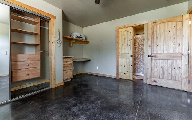 5550 Farm To Market Rd, Whitefish, MT 59937 - unfurnished bedroom with concrete flooring and baseboards