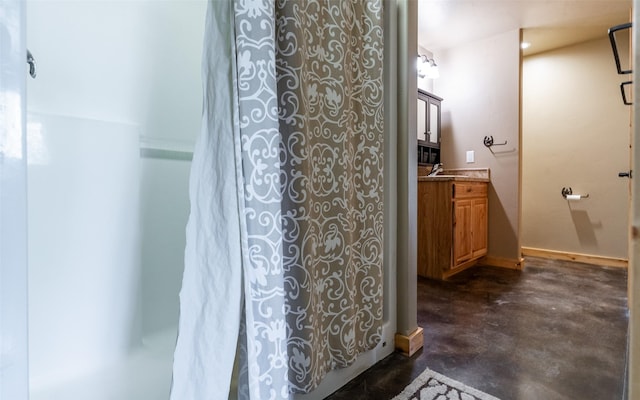 5550 Farm To Market Rd, Whitefish, MT 59937 - bathroom with finished concrete flooring, vanity, and curtained shower