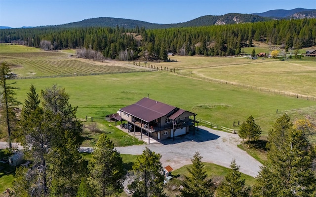 5550 Farm To Market Rd, Whitefish, MT 59937 - overview of rural landscape featuring a mountain backdrop and a heavily wooded area