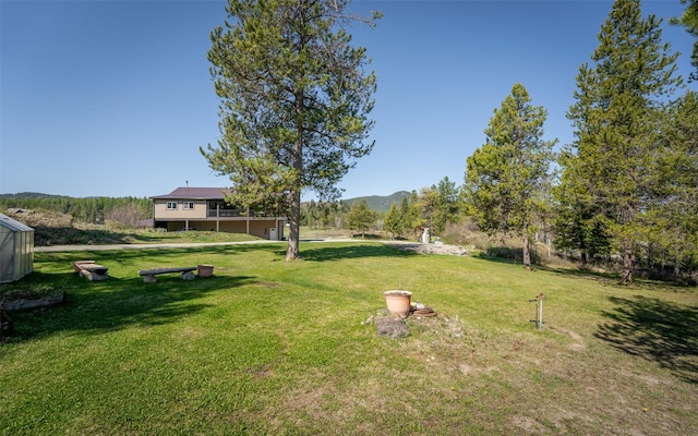 5550 Farm To Market Rd, Whitefish, MT 59937 - view of green lawn featuring a mountain view