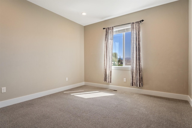 spare room with carpet, baseboards, and recessed lighting