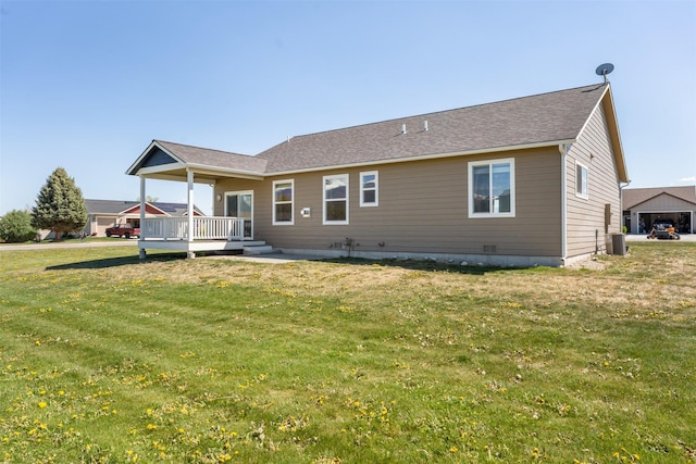 back of house with a lawn and cooling unit