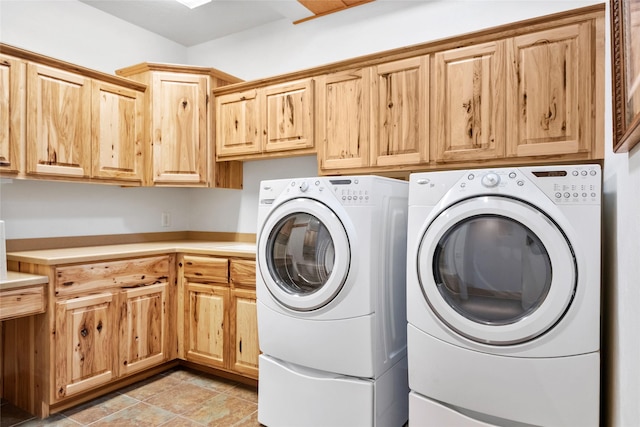 laundry room featuring cabinet space and independent washer and dryer
