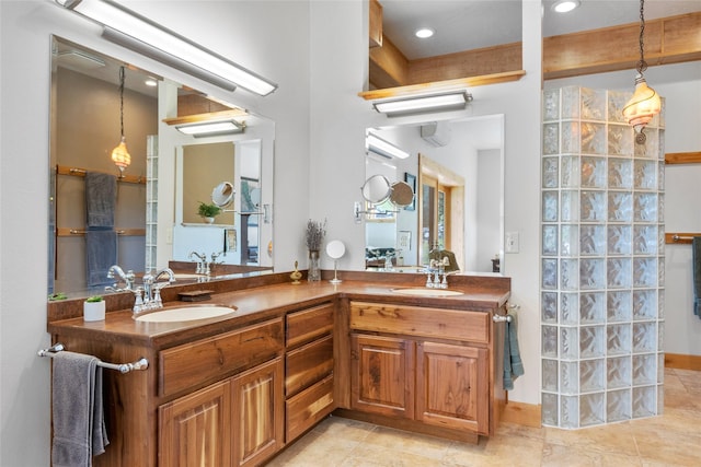 full bathroom with double vanity, tile patterned flooring, and recessed lighting