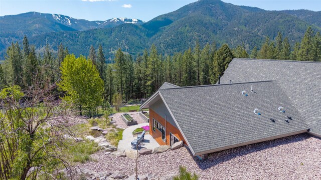 view from above of property with mountains and a forest