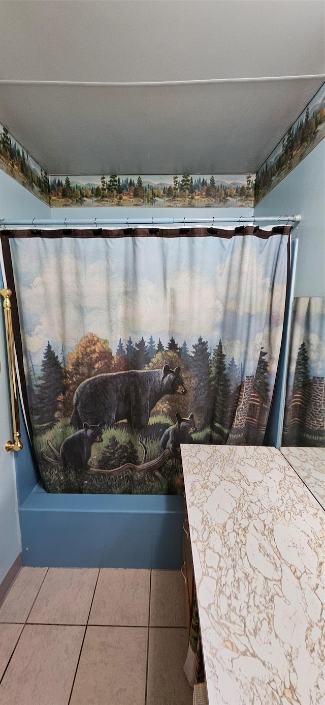 11169 Stemple Pass Rd, Lincoln, MT 59639 - bathroom featuring a bathtub, baseboards, and tile patterned floors