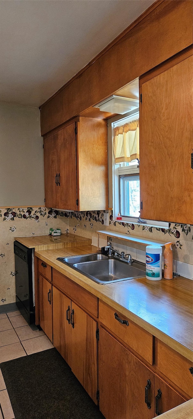 11169 Stemple Pass Rd, Lincoln, MT 59639 - kitchen featuring dishwasher, a sink, light countertops, and light tile patterned flooring