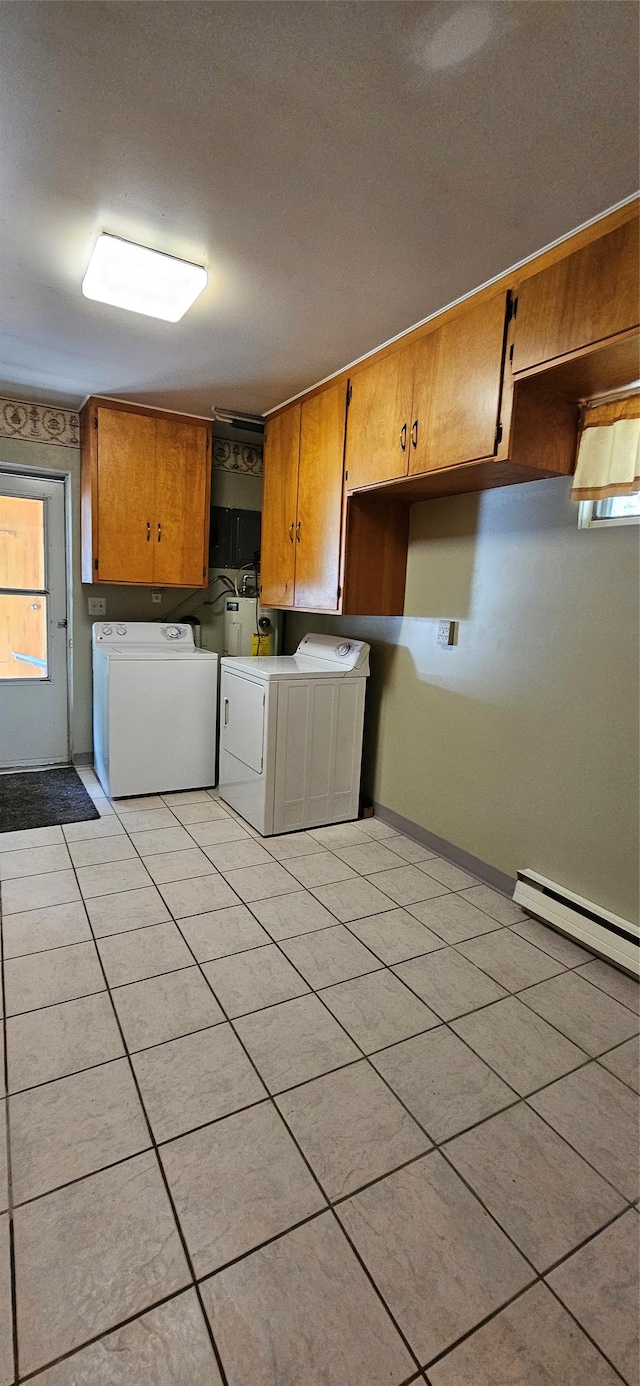 11169 Stemple Pass Rd, Lincoln, MT 59639 - washroom with washing machine and dryer, cabinet space, light tile patterned floors, and healthy amount of natural light